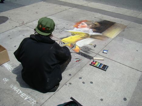 sidewalk chalk artist makes spare change while drawing pictures