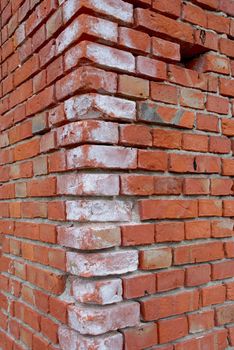 Corner of house build with red bricks