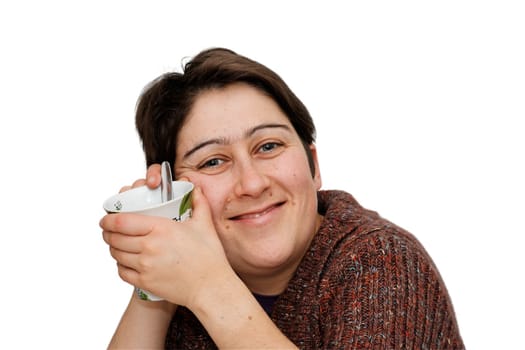 Smiling mid age woman holding a cup isolated