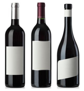 Three merged photographs of different shape red wine bottles with blank labels.  Separate clipping paths for bottles and labels included.