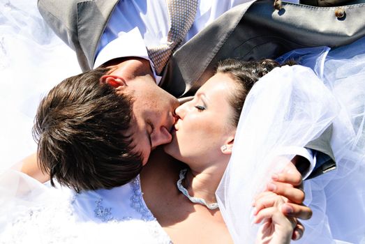 Kissing Bride and Groom.