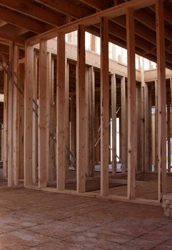 The wood framing of the interior of a new housing project.
