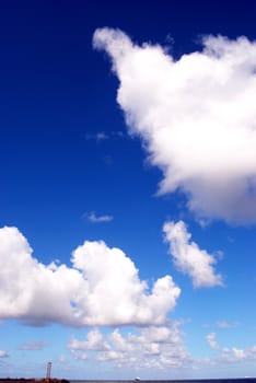 Castles of clouds over the sea horizon line