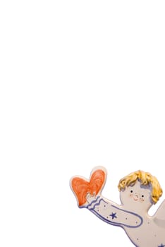 Fragment of ceramic boy holding heart isolated on a white background