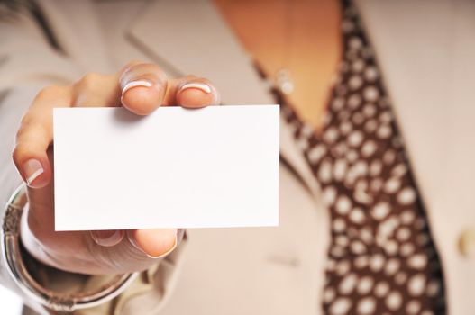 woman showing her business card with focus on the card.