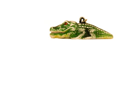 Green crocodile shaped toy isolated on a white background