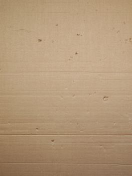 Brown corrugated cardboard packaging useful as a background