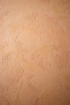 Shot of clay-colored embossed wallpaper on the wall