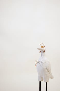 White ceramic bird figure isolated on a white background