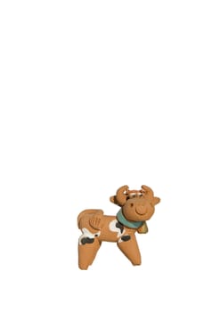 Cow made of clay with bell isolated on a white background