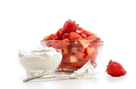 Fresh strawberries with whipped cream on white background