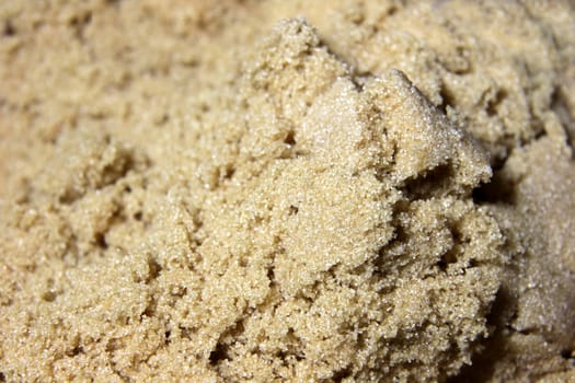 A close-up of brown sugar crystals.
