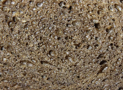 A background of a close-up of pumpernickel bread.