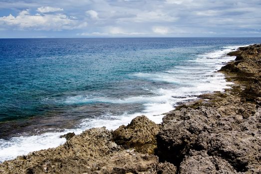 It is a beautiful coral reef rock coastline with blue sky in kenting of Taiwan.