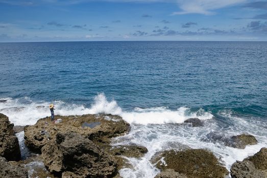 It is a beautiful coral reef rock coastline with blue sky in kenting of Taiwan.