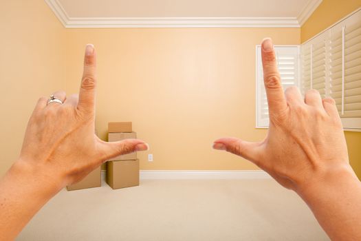 Female Hands Framing Beautiful Room Interior Imagining What to Do with the Room.