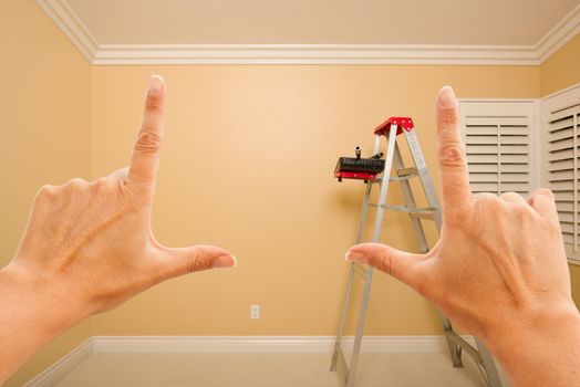 Female Hands Framing Beautiful Room Interior Imagining What to Do with the Room.