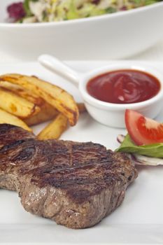 steak and french fries on a plate