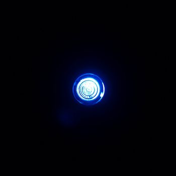 Blue light blur over dark black background