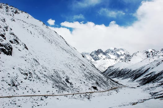 Landscape of high mountains covered with snow in winter