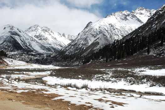 Landscape of high mountains covered with snow in winter