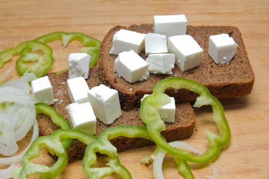 Feta cheese cubes with bread and pepper