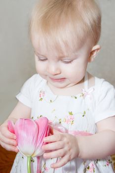 Baby girl in dress with tulip