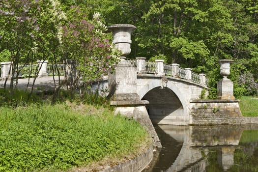 Classical stone bridge with vases