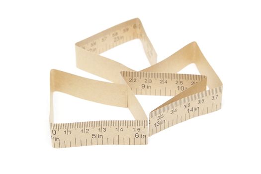 Paper measuring tape with inch and centimeter marks isolated on white background