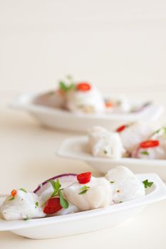 Small seafood dish with raw cod marinated in lime juice