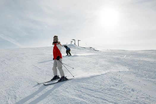 Skiing in the mountains, female skier