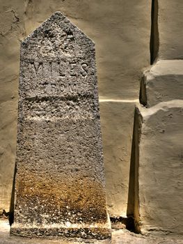 HDR image of old British milestone in Malta defaced during WWII 