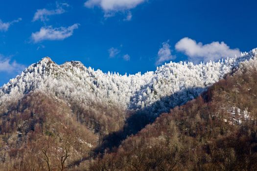 Famous Smoky Mountain view of Chimney Tops covered in snow in early spring