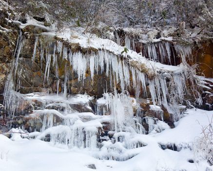 Icicles frozen to rock face on famous weeping wall in Smoky Mountains