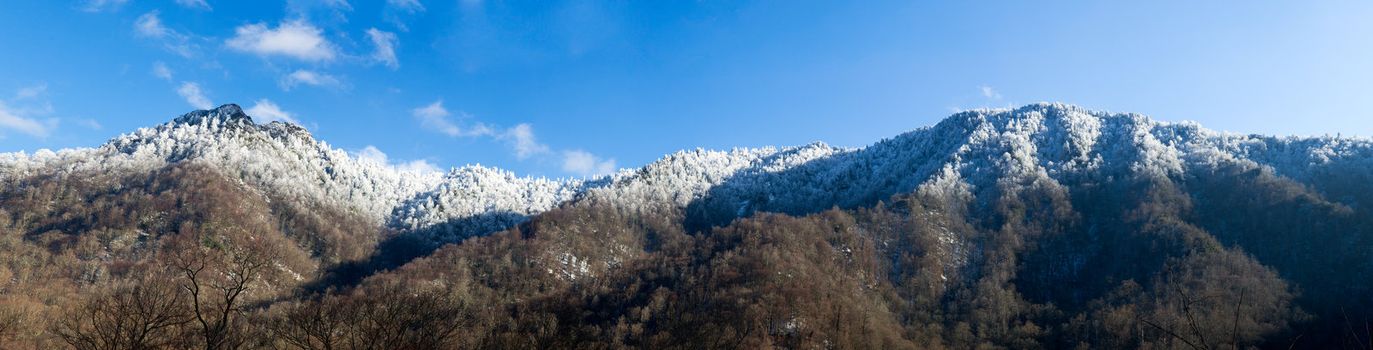 Famous Smoky Mountain view of Chimney Tops covered in snow in early spring