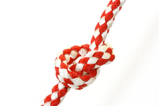 Rope with knot close up. Isolated on white background.