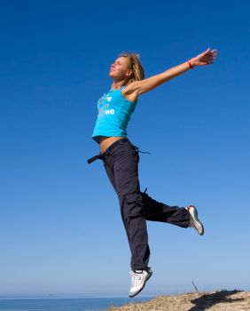 jumping girl blue sky high