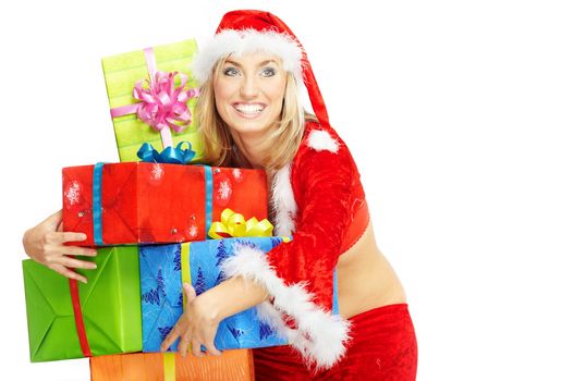 Smiling happy lady in the red Santa Claus costume holding gift boxes on a white background