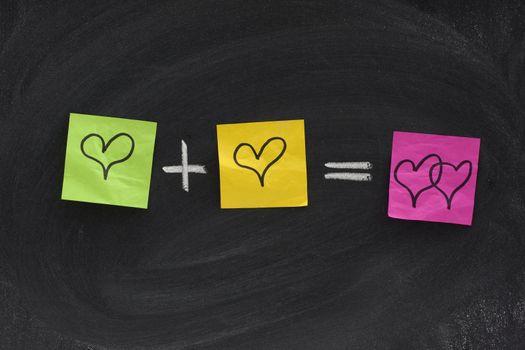 love or romantic relationship concept presented as mathematical equation with hearts, colorful sticky notes, white chalk on blackboard