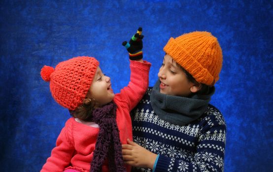Brother and sister having fun in winter outfit. Look at my gallery for more winter images
