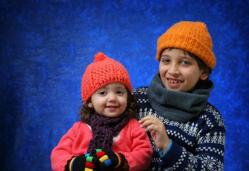 Brother and sister having fun in winter outfit. Look at my gallery for more winter images