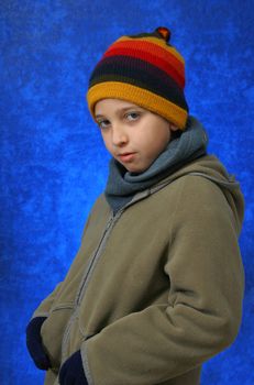 Boy portrait in winter outfit looking at camera. Look at my gallery for more winter images