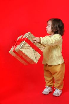 Cute little girl with a christmas gift