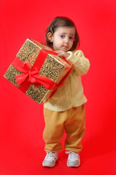 Cute little girl with a christmas gift