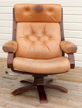 Old dirty and worn leather recliner chair