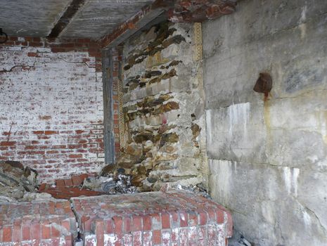 The inside walls of a building that are crumbling with age due abandment.