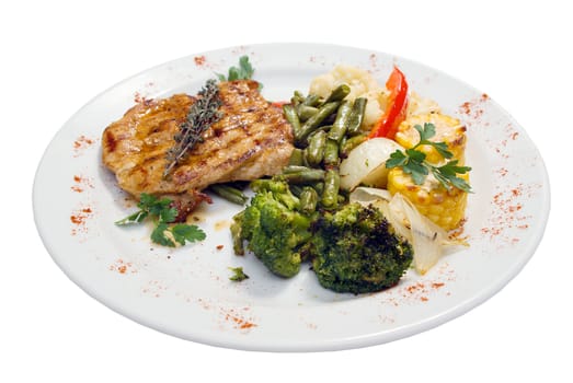 Grilled steak with french fries and broccoli on a white plate