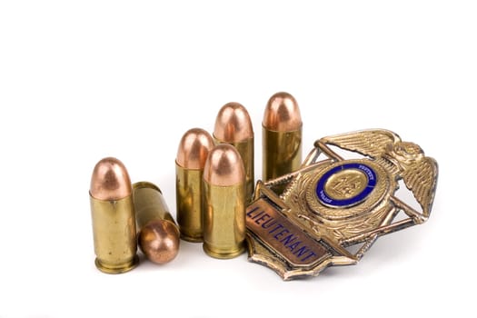 Police badge and bullets on a white background