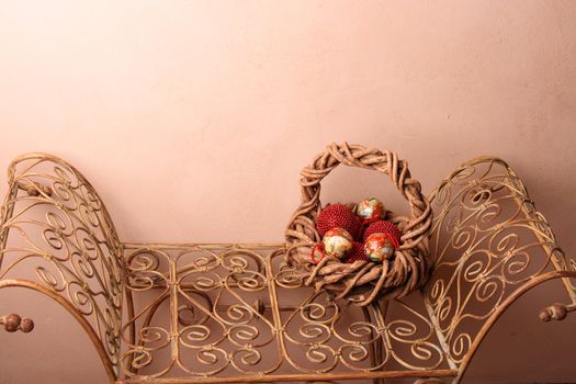Woven Christmas basket on an old rustic bench