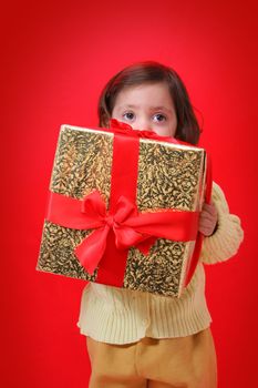 Cute little girl with a christmas gift